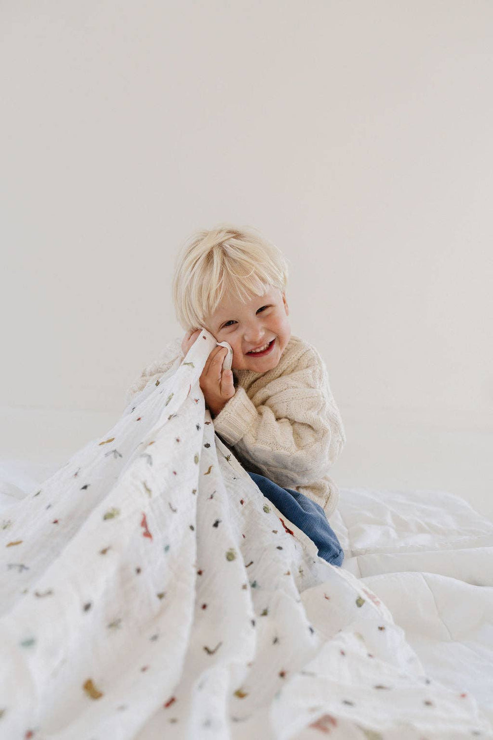 A swaddling muslin blanket from Clementine Kids, the Cutie Crawlies Swaddle keeps newborns snug and calm.