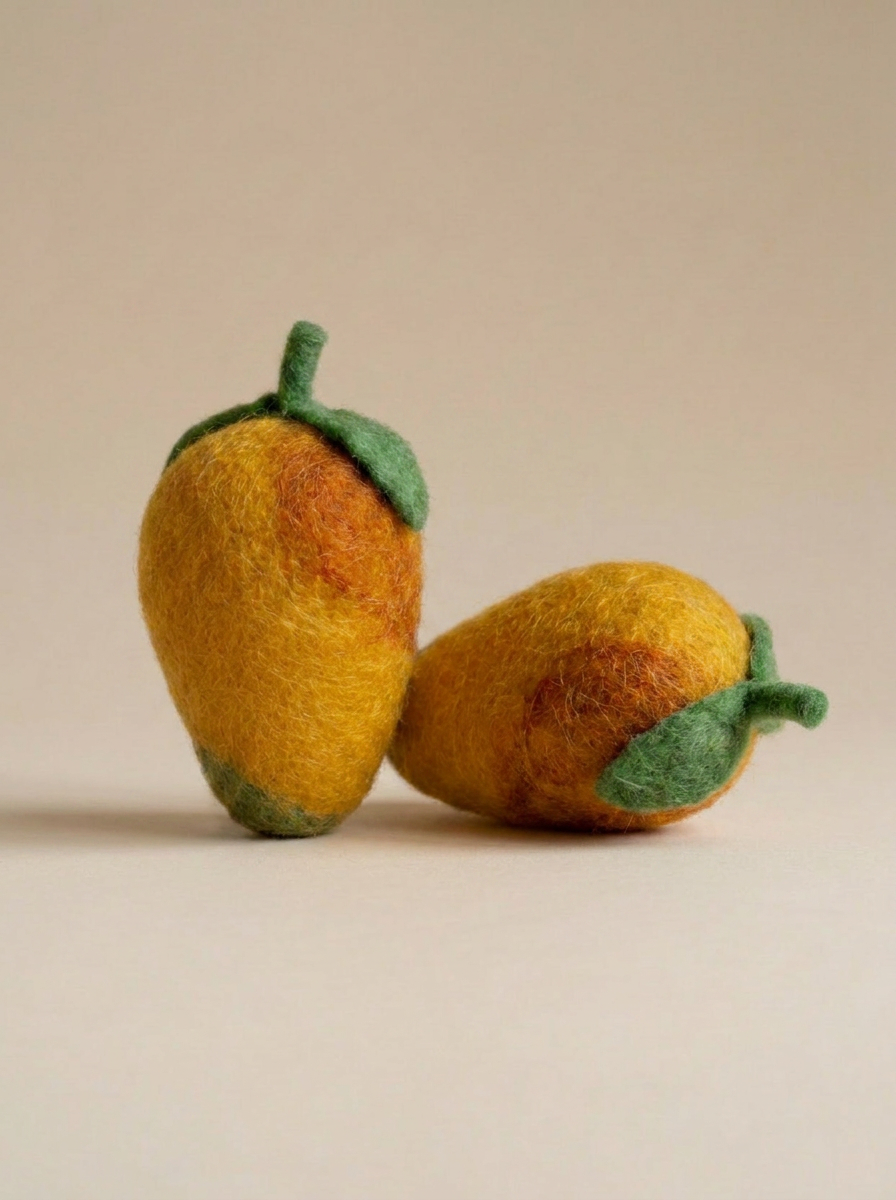 Close-up of Kaddu's Felt Mango showing tropical wool detail