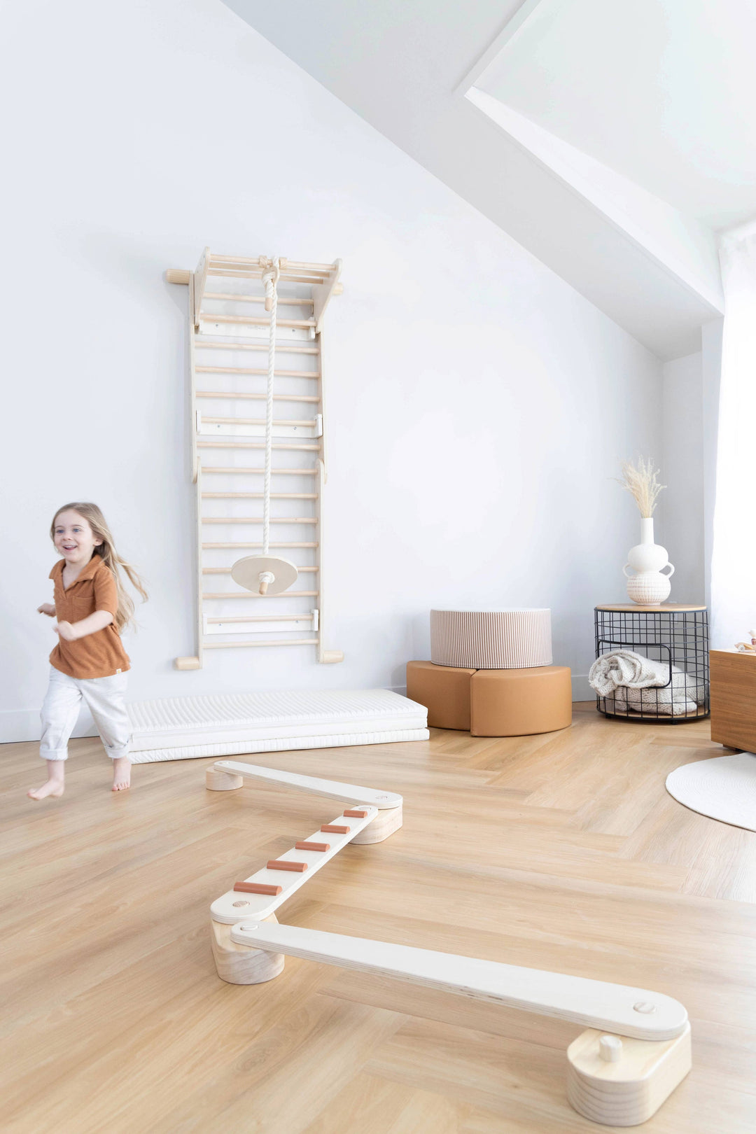 Adventure awaits with the Coco Village Montessori 2-in-1 Triangle & Wall Climber in Natural, a beautifully crafted pretend play structure.
