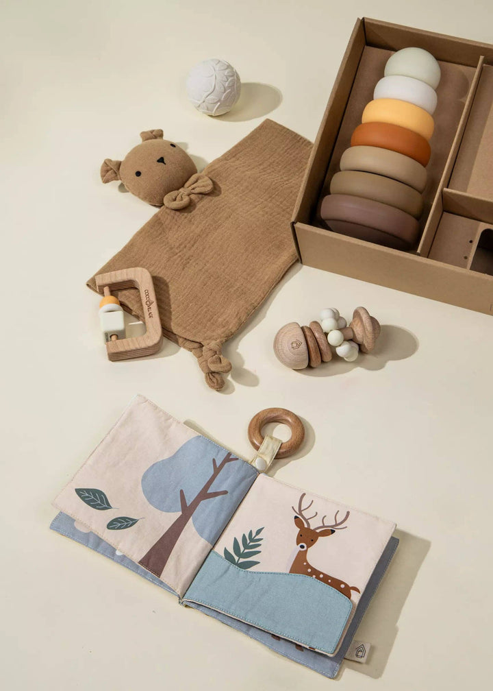 Perfectly packaged for gifting, the Coco Village Baby First Toys Gift Box makes a beautiful baby shower gift with developmental play in mind.