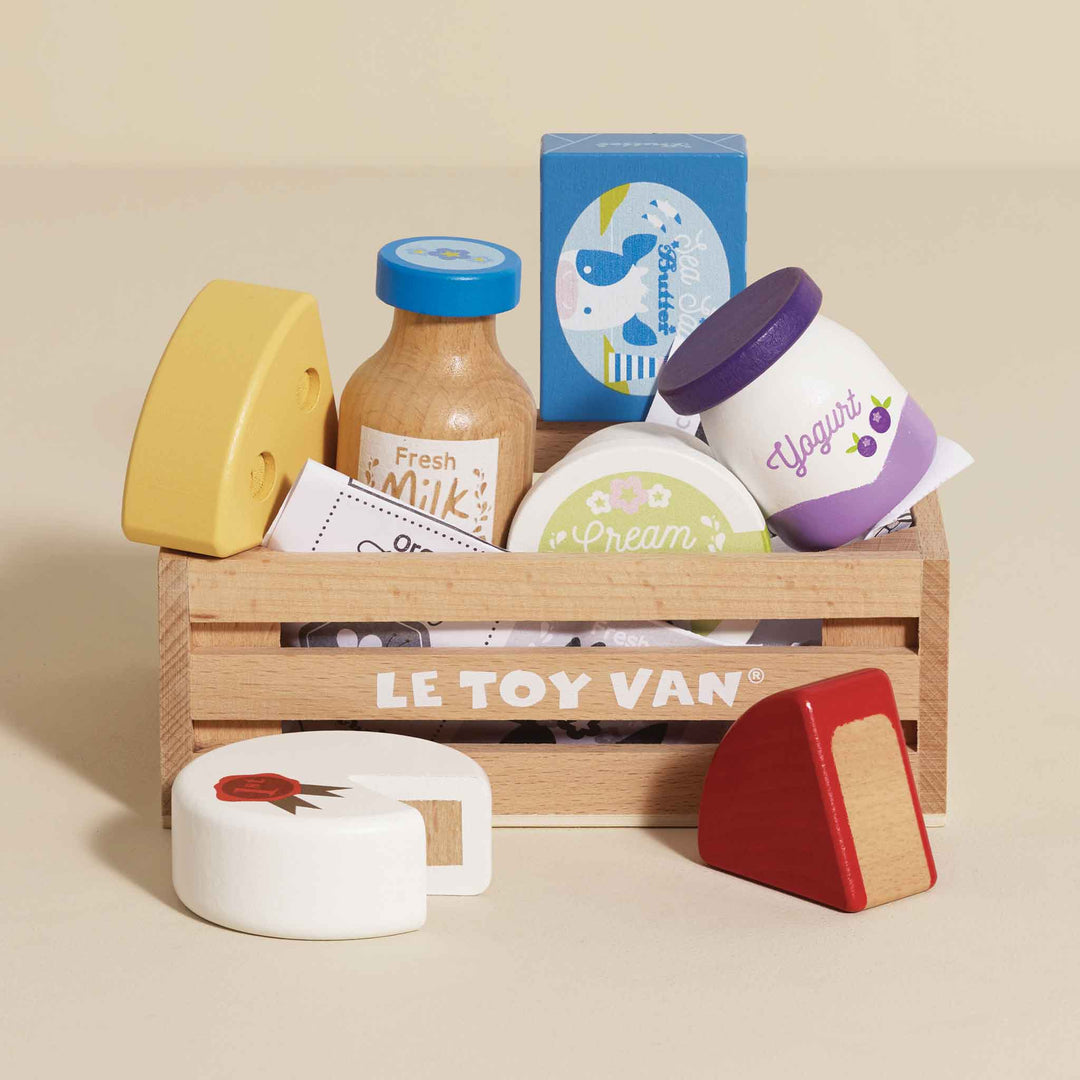Little shoppers will love the Le Toy Van Cheese & Dairy Wooden Market Crate, a wooden toy for creative play.