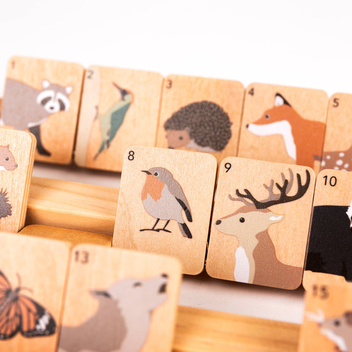 The Egmont Who Am I set includes numbered wooden tiles picturing a hedgehog, deer, and songbird