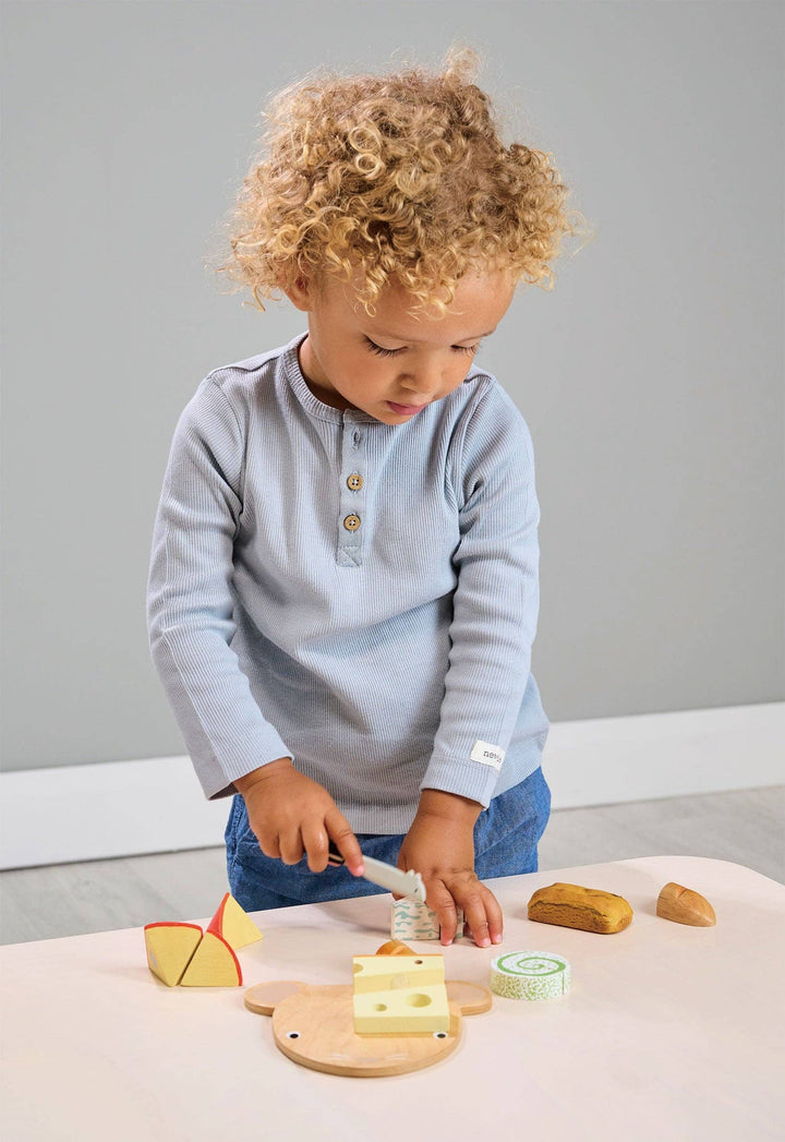 This educational toy from Tenderleaf Toys turns cheese chopping into a playful learning experience.