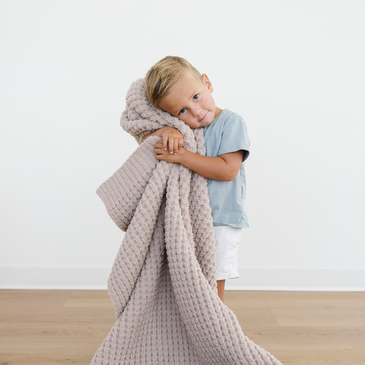 Wheat Saranoni Waffle Knit Toddler Blanket surrounds your child in warmthÑan ideal baby blanket choice.