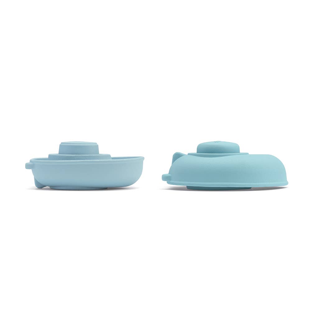 Bright pastel blue toddler bath toys from Plantoys, featuring the Farm Rubber Convertible Boat for safe splash fun.