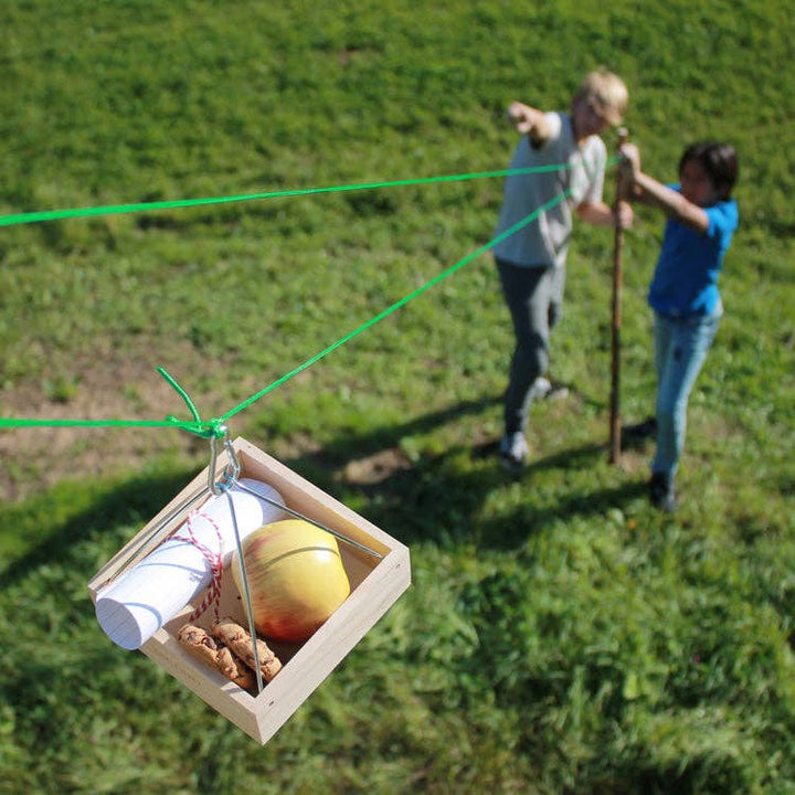 Children playing with Huckleberry Cable Transport outdoors toy