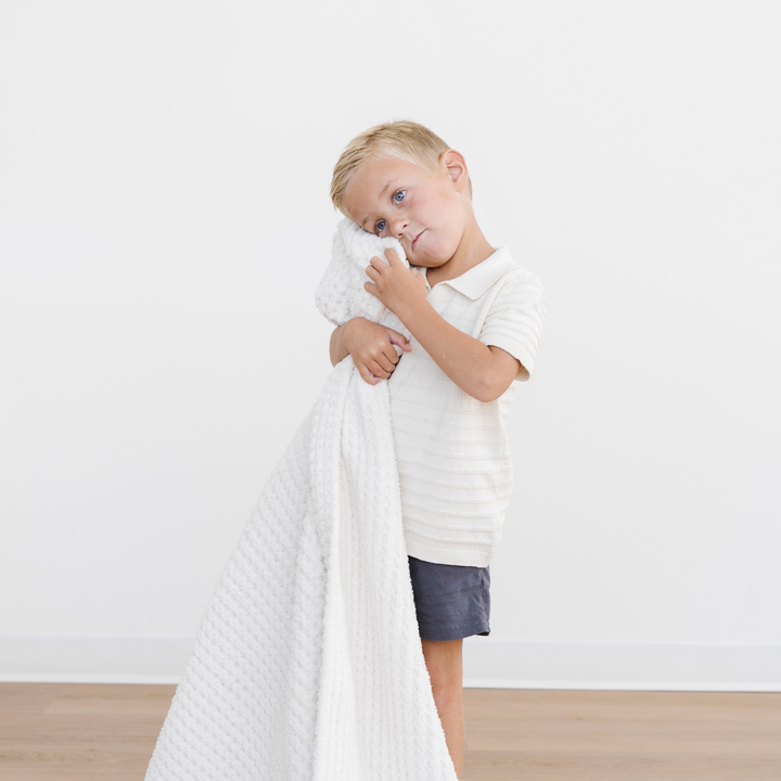 The Swan Saranoni Waffle Knit Toddler Blanket gives gentle warmth, earning its place among the best baby blankets.
