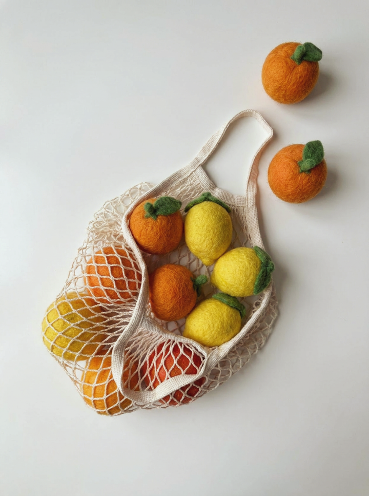 Detail shot of Kaddu's Felt Orange showing handcrafted wool texture