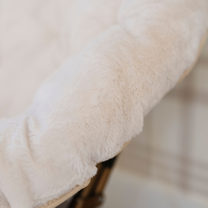 Soft and inviting, the Cream Saranoni Saucer Chair makes a charming chair for kids.