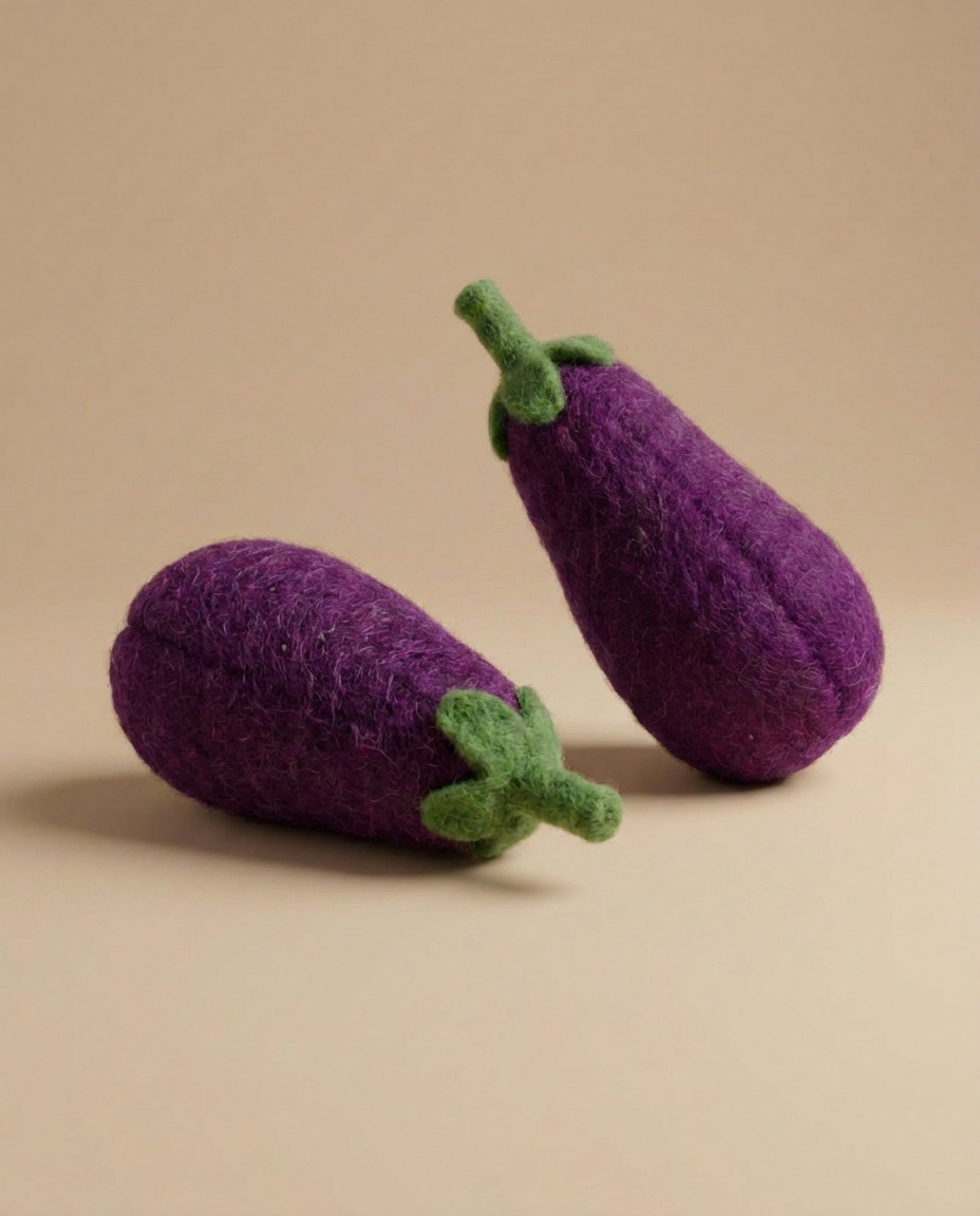 Detail shot of Kaddu's Felt Eggplant showing handcrafted wool texture