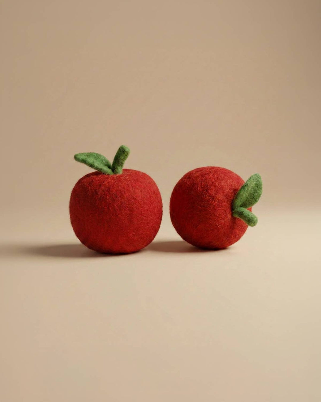 Close-up of Felt Apple play food by Kaddu, ideal Montessori sensory toy