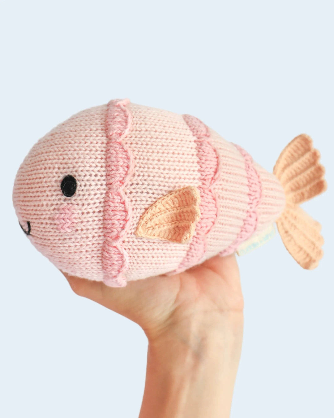 Hand-knit fish plush toy: Cuddle + Kind Baby Fish, a soft heirloom baby gift