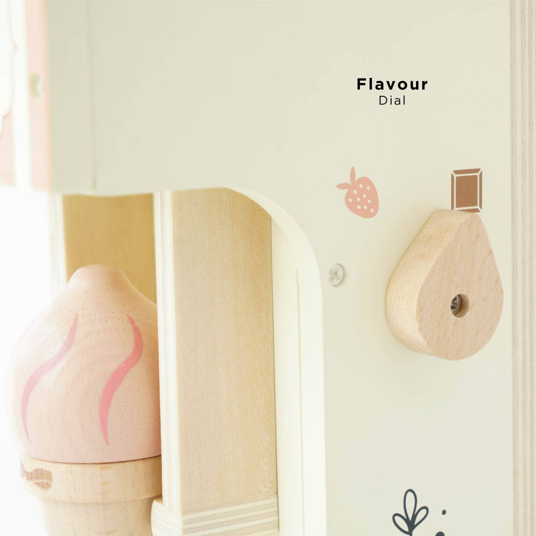 A close up of the flavour dial on the side of Le Toy Van's Ice Cream Machine, set beside a pink cone