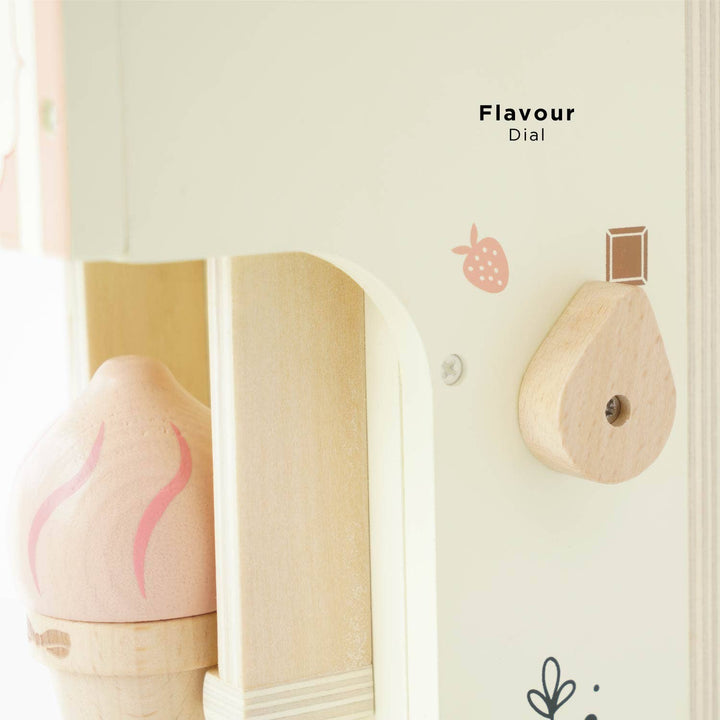 A close up of the flavour dial on the side of Le Toy Van's Ice Cream Machine, set beside a pink cone