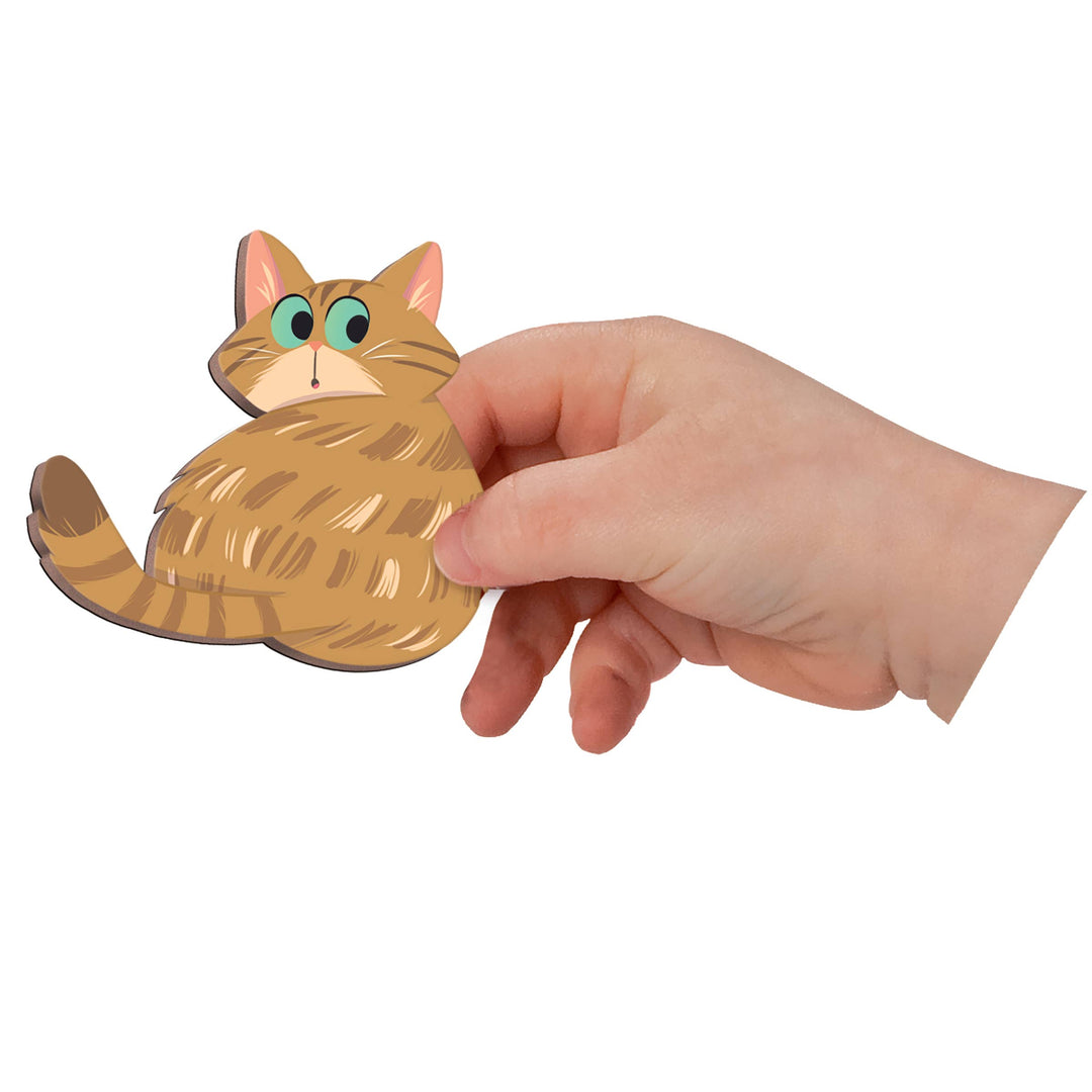 Child arranging magnetic toys pieces from Janod Magneti'stories Cats