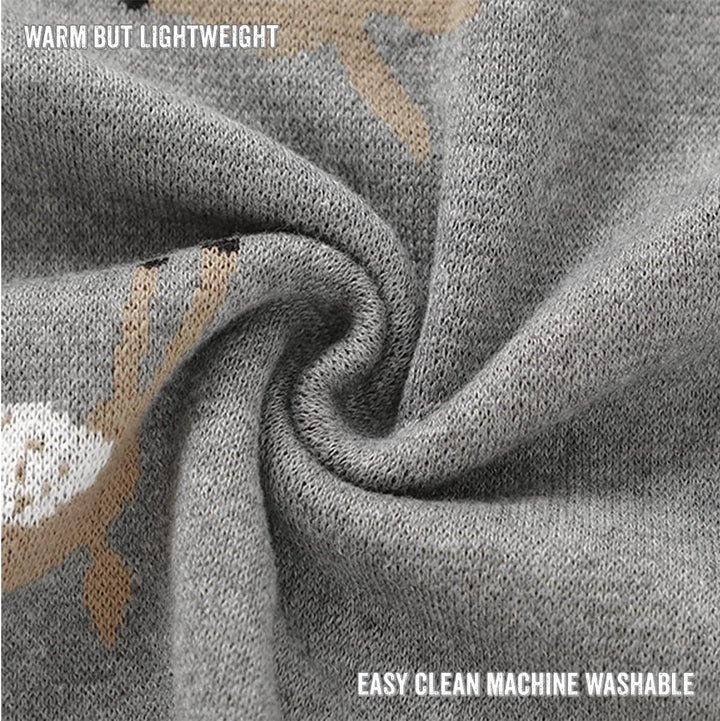 Detailed view of the deer pattern on a Bleu La La knit swaddle blanket, soft stretchy cotton and washable