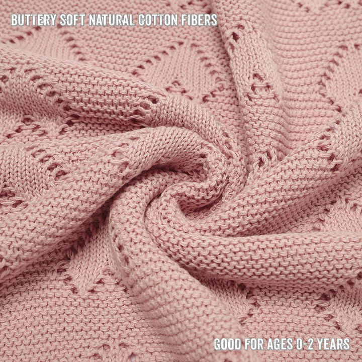 Close-up of Bleu La La 100% Cotton Luxury Knit Heart Swaddle Baby Blanket in rose pink highlighting OEKO-TEX certified cotton knit.