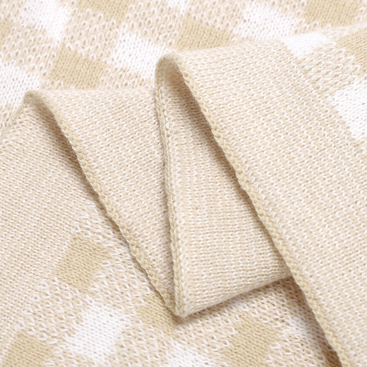 Pink Bleu La La checkered knit baby blanket folded flat, modern cotton blanket for nursery styling