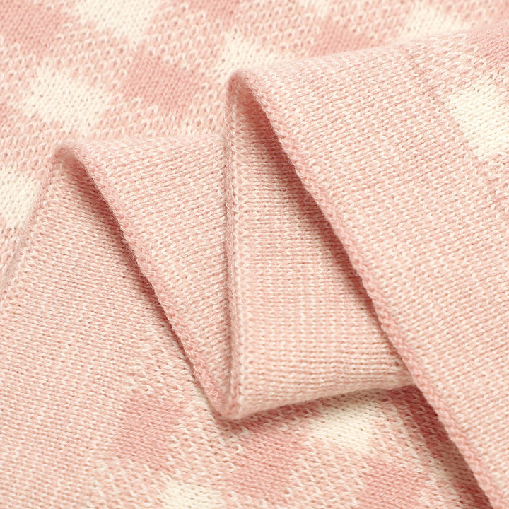 Mother holding baby wrapped in a Bleu La La checkered knit blanket, cozy neutral baby essential