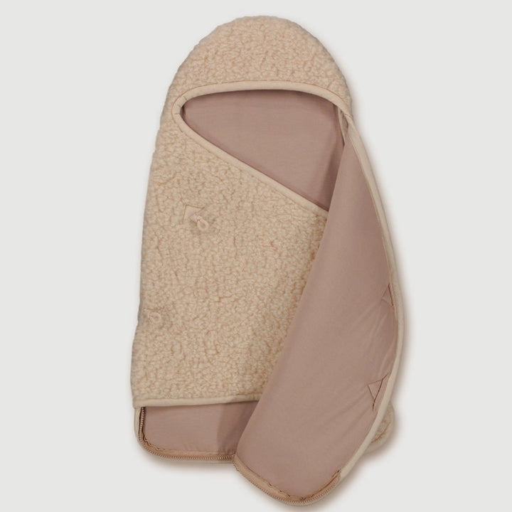 Finch & Fable Wool Cocoon in Oat offers cozy comfort for little onesÑan essential baby sleep sack for restful nights.