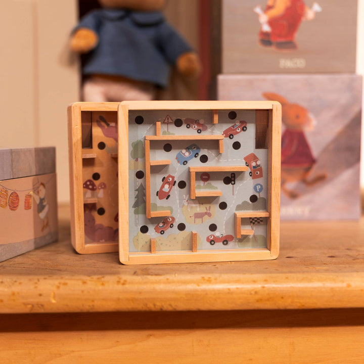 The Mini Wooden Labyrinth from Egmont stands beside its packaging box on a wooden shelf