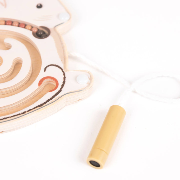 Egmont's Mini Magnetic Color Maze mouse piece rests with a dangling cord and wooden grip