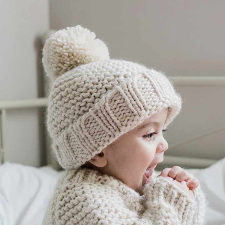 Huggalugs Natural Garter Stitch Beanie Baby & Kids, a versatile baby hat for toddlers and infants.