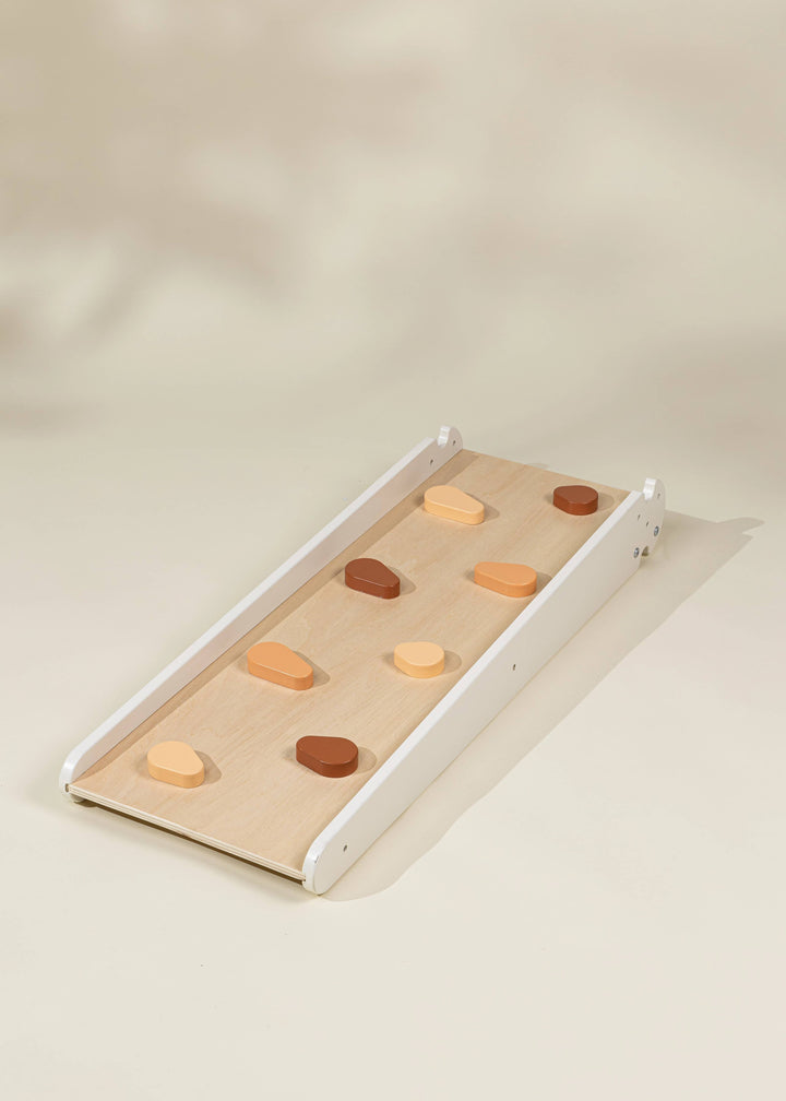 Crafted for balance, the Coco Village Montessori 2-in-1 Grip Climber Board & Slide in Natural wood makes an ideal toddler toys essential.