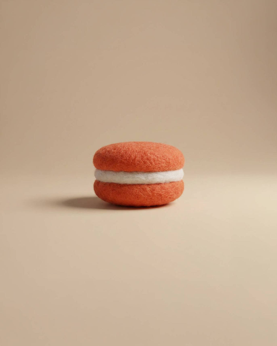 Close-up of Kaddu's Felt Macaron showing soft wool bakery detail