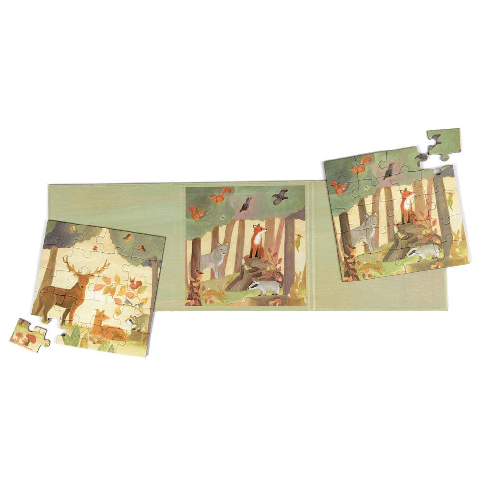 Loose puzzle pieces from Egmont's Forest Magnetic Puzzle click together revealing painted trees and greenery