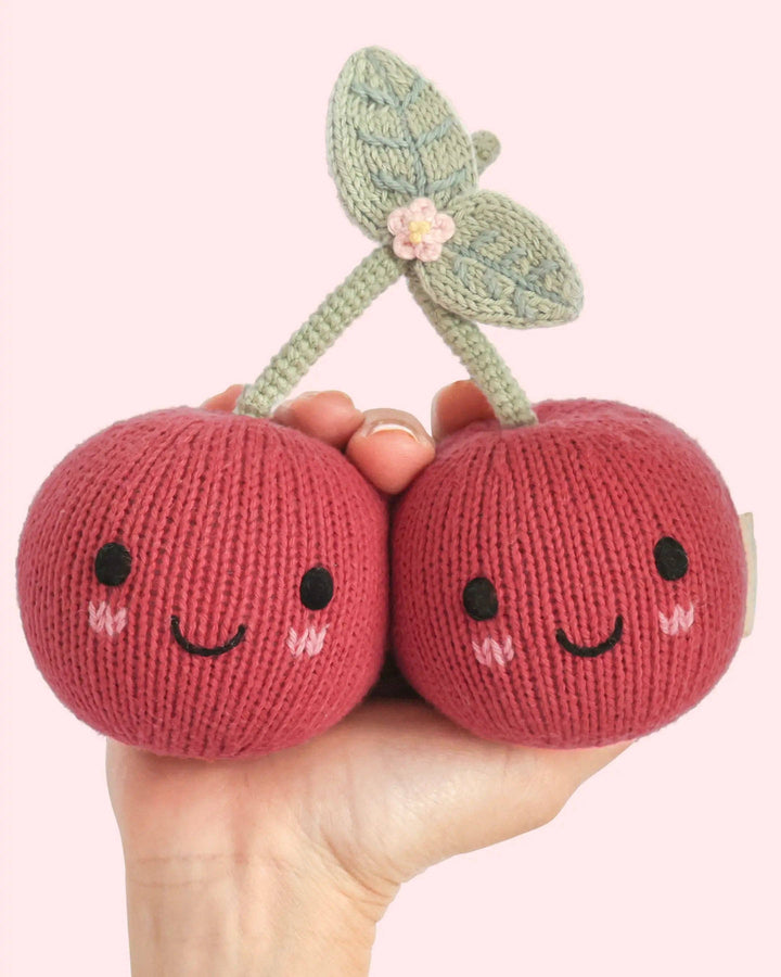Hand-knit cherry plush toy: Cuddle + Kind Baby Cherries, a soft heirloom baby gift