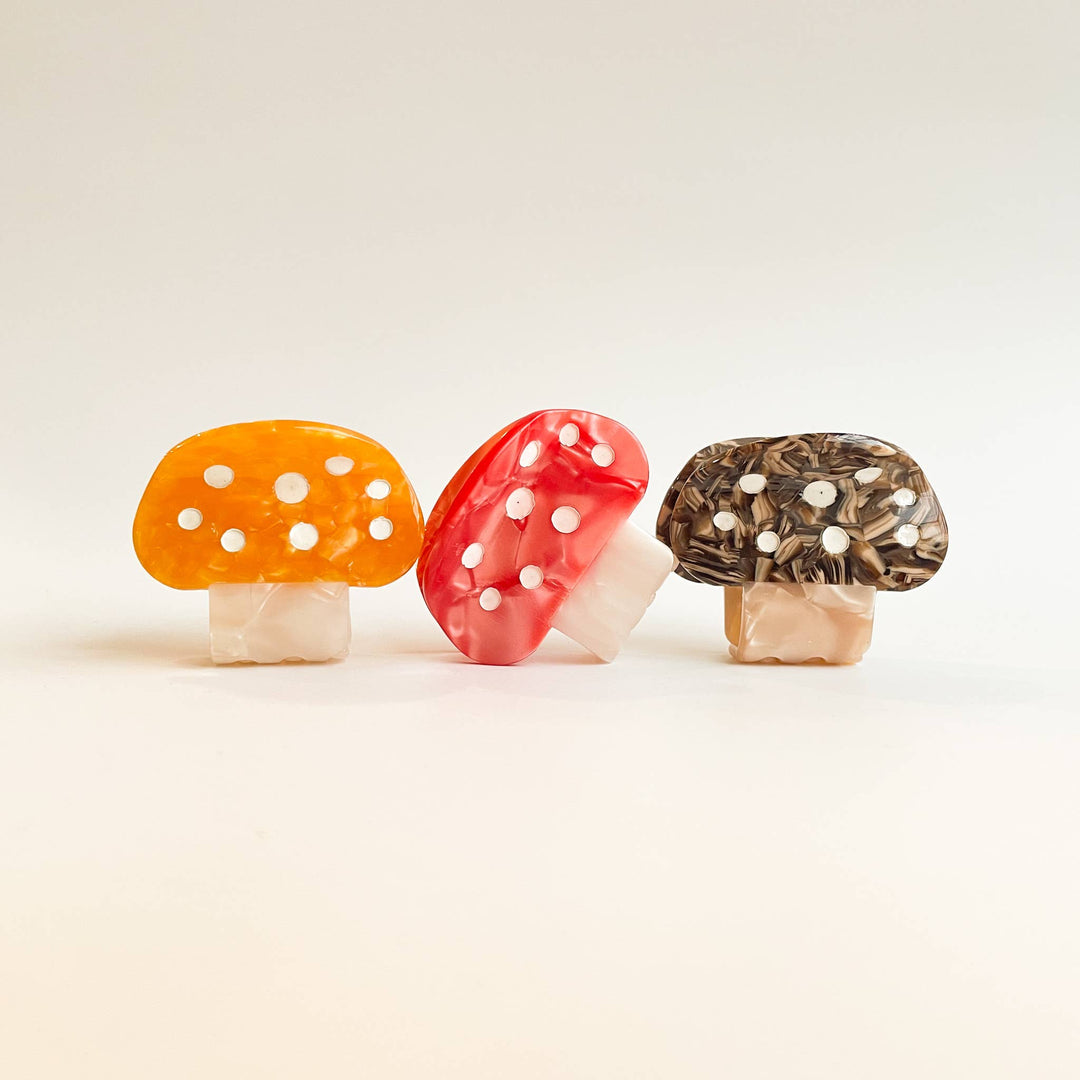 Adorro mushroom small claw clip flat lay showing color options cute and functional hair clip designed for kids fine and medium hair