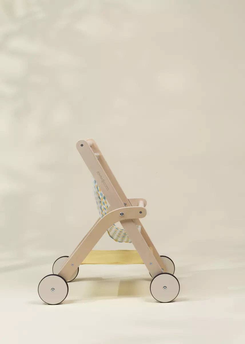 Back angle of Coco Village's wooden toy stroller showing sturdy frame construction for toddlers