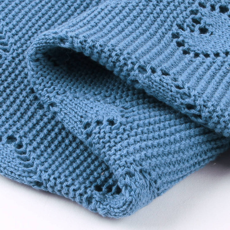 Closeup of a Folded blue knitted Bleu La La Cotton Receiving Swaddle Baby Blanket with a Heart Pattern in denim blue