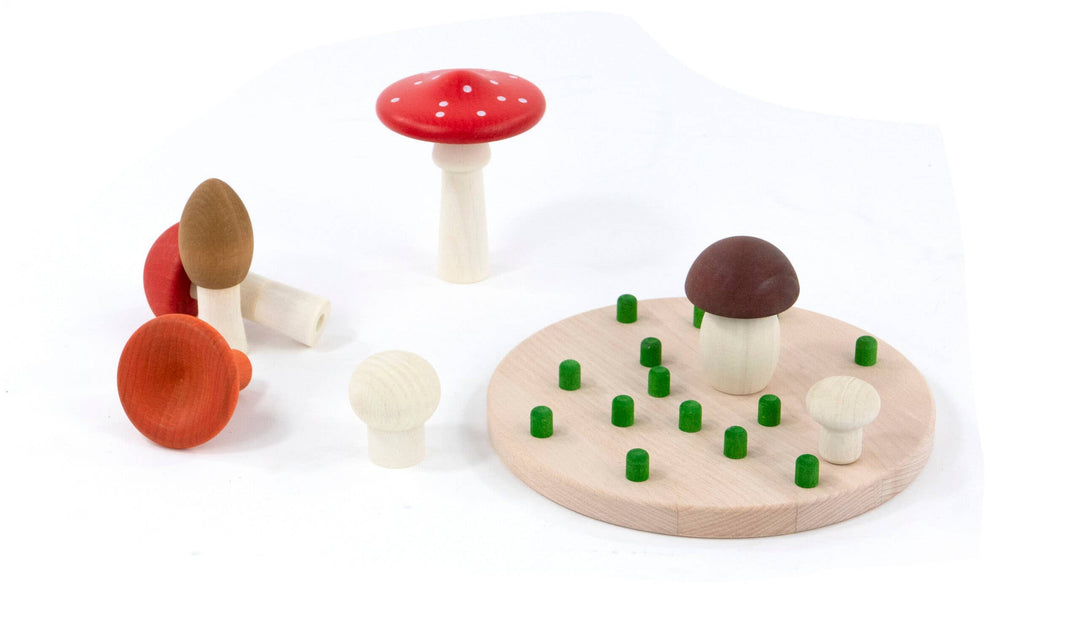 Bajo Mushrooms Sorter with pieces lifted off the board to show green pegs, wooden shape sorting game for fine motor skills