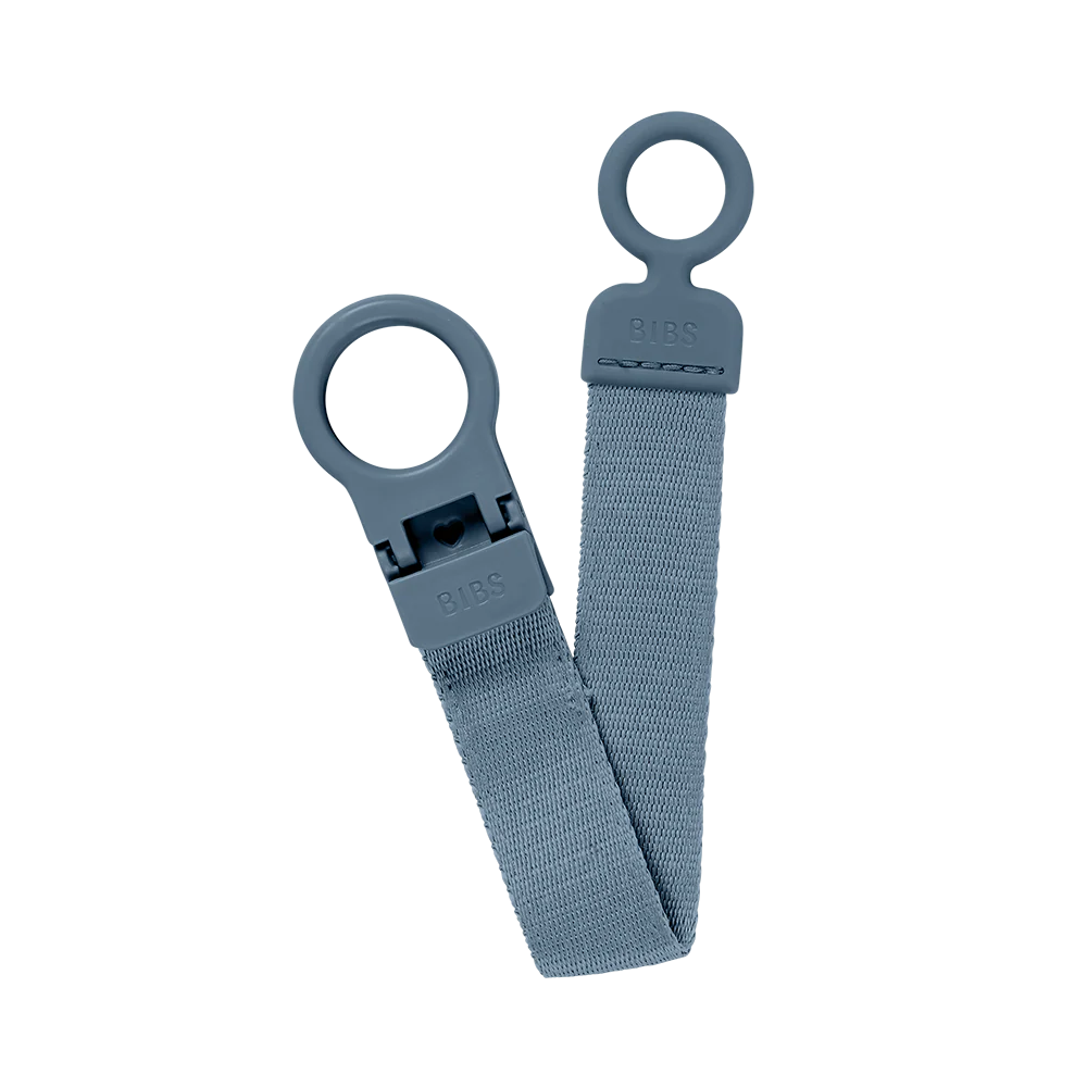 Close-up of BIBS Pacifier Clip Petrol, durable choice for baby binky.