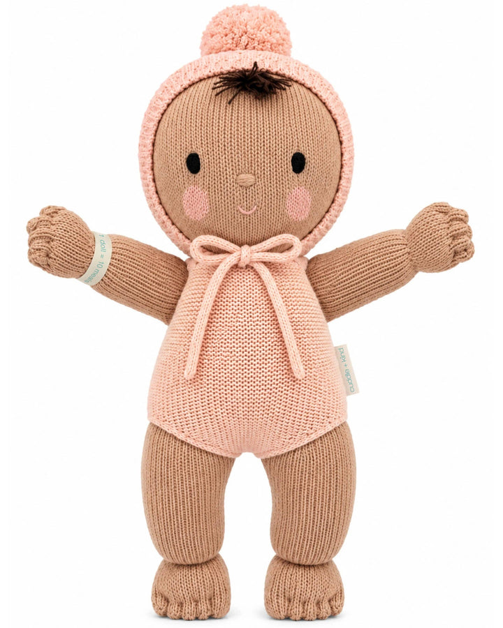 Cuddle + Kind My First Baby in Peach, a 14-inch hand-knit baby doll and heirloom first doll