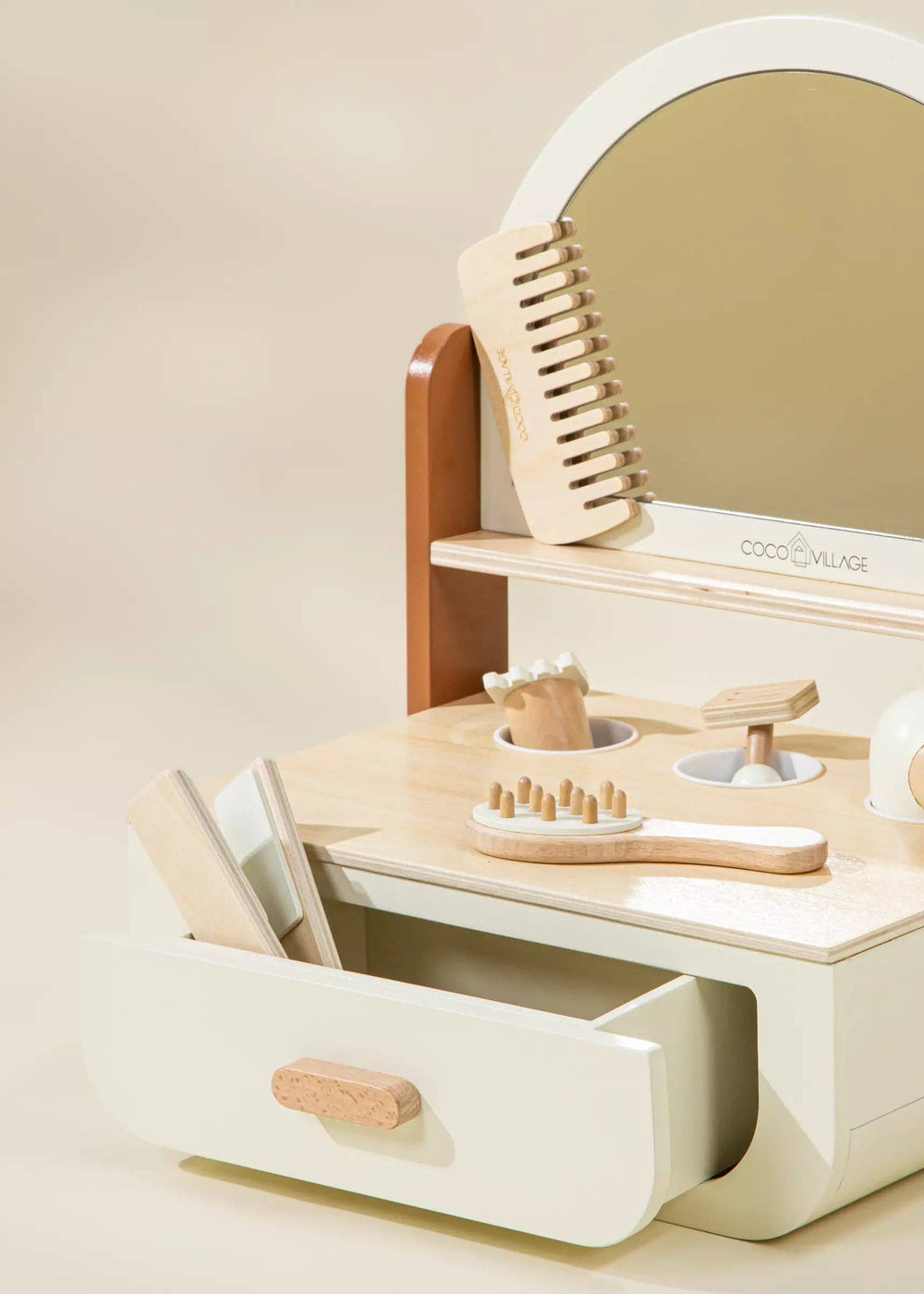 In warm Peach tones, the Coco Village Wooden Beauty Station Playset inspires toddler toys fun with brushes, scissors, and role-play tools.