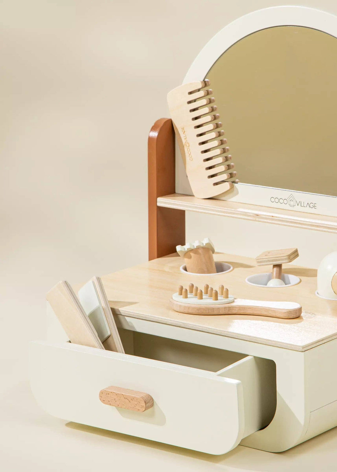 In warm Peach tones, the Coco Village Wooden Beauty Station Playset inspires toddler toys fun with brushes, scissors, and role-play tools.