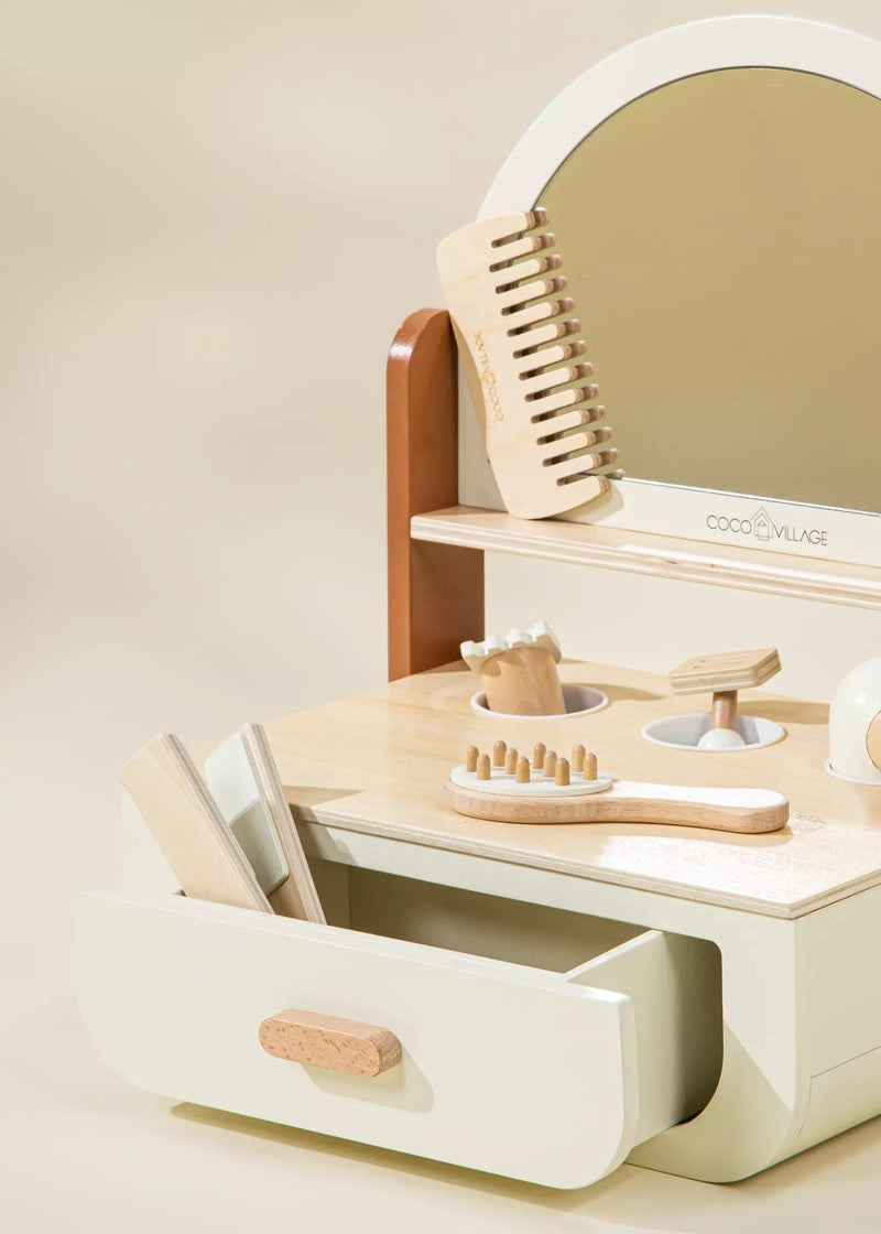 In warm Peach tones, the Coco Village Wooden Beauty Station Playset inspires toddler toys fun with brushes, scissors, and role-play tools.