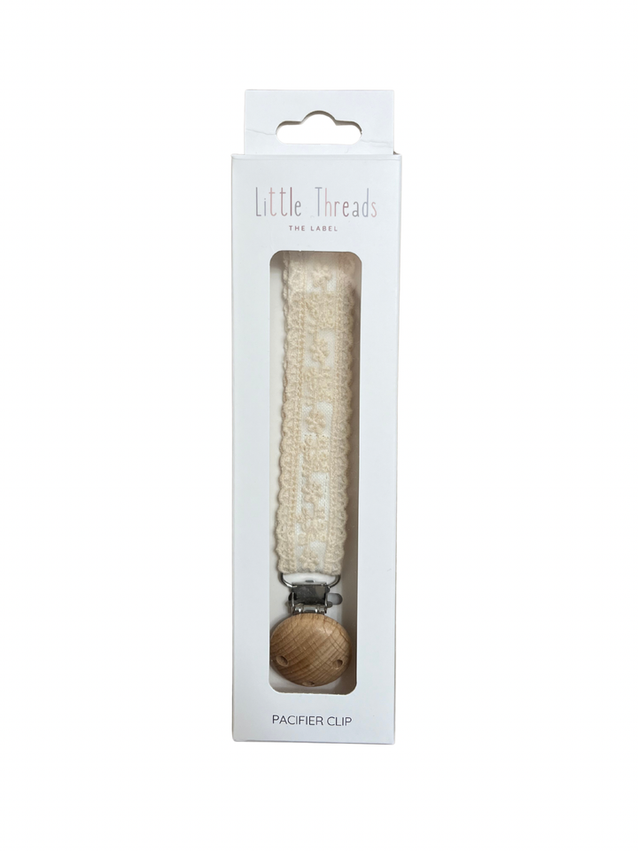 Little Threads Ivory Floral Lace Pacifier Clip in its window gift box, a ready to give baby shower present for newborns