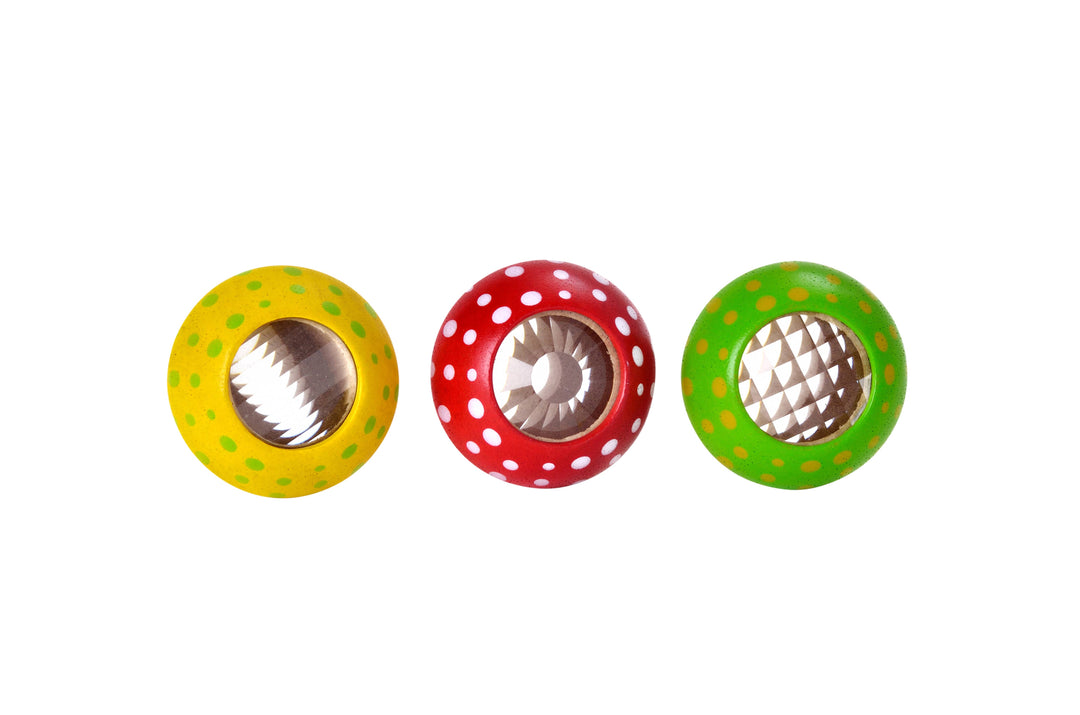 Top view of PlanToys mushroom kaleidoscope lenses with colorful patterns for visual play