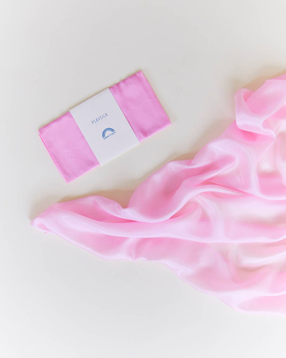 Pink silk scarf flat lay, Sarah's Silks Solid Color Playsilks, a favorite for imaginative play