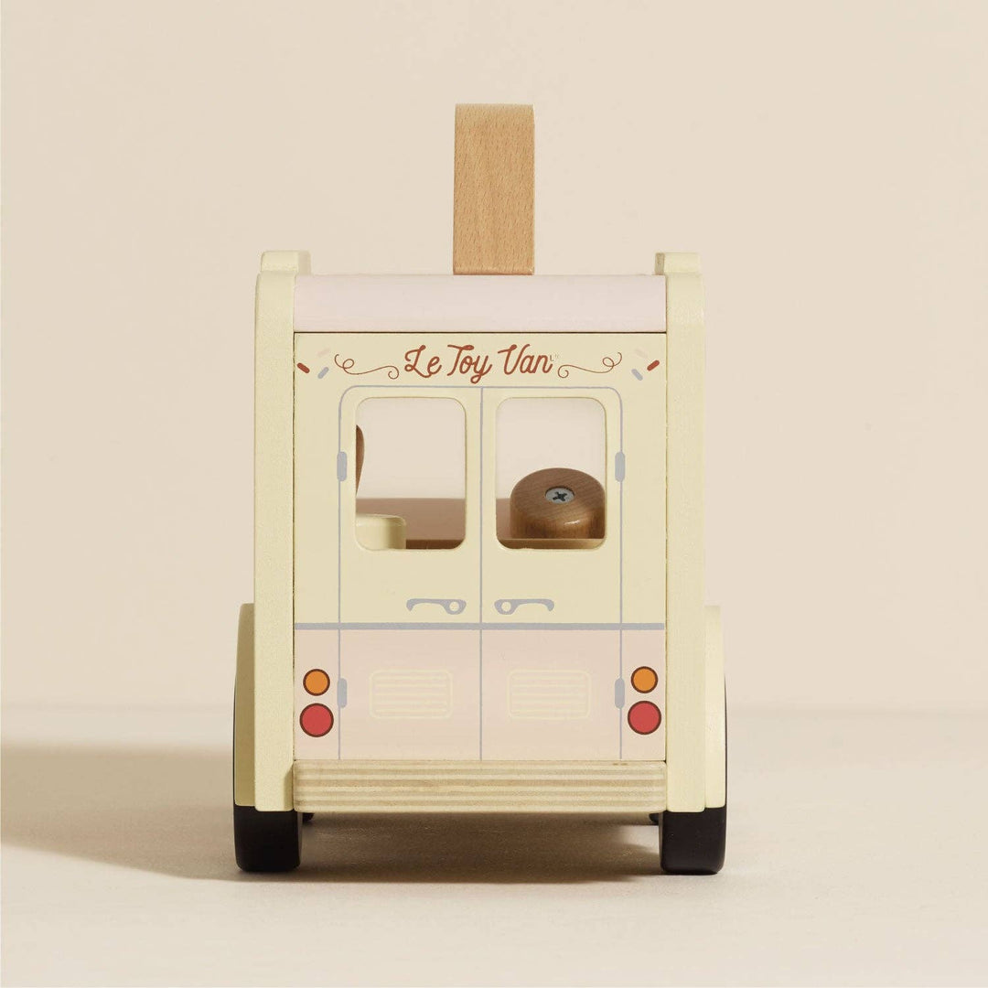Le Toy Van FSC-certified wooden ice cream van side profile showing cream and grey hues