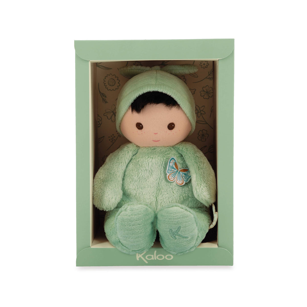 Close up of Janod Tender Baby Pilea Doll brown hair and eyes