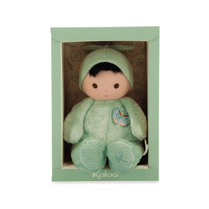 Close up of Janod Tender Baby Pilea Doll brown hair and eyes