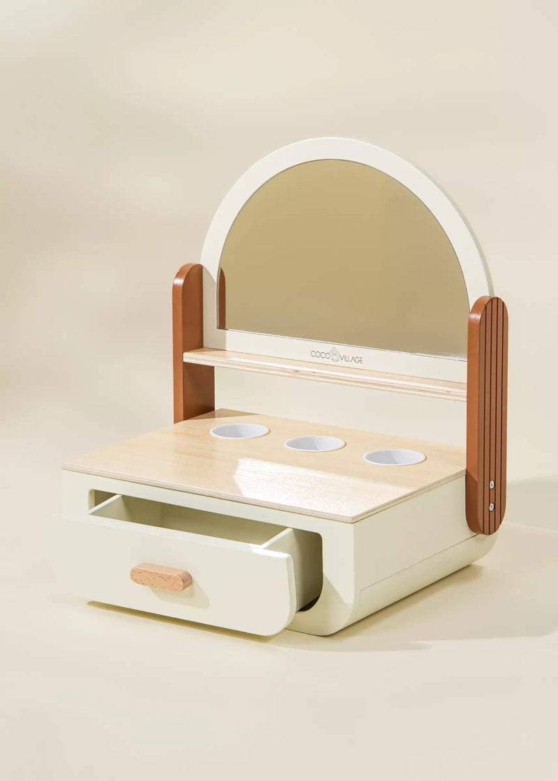 Add a playful touch with the Coco Village Wooden Beauty Station Playset in Peach, a delightful pretend play activity for stylish kids.