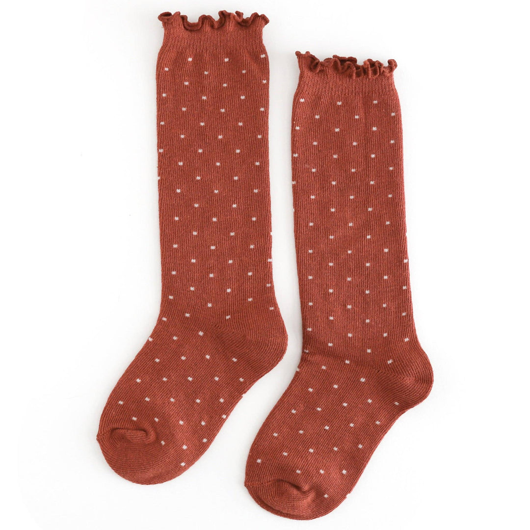Rust polka dot knee socks with a ruffled cuff, Little Stocking Co.'s Dottie style for baby girls
