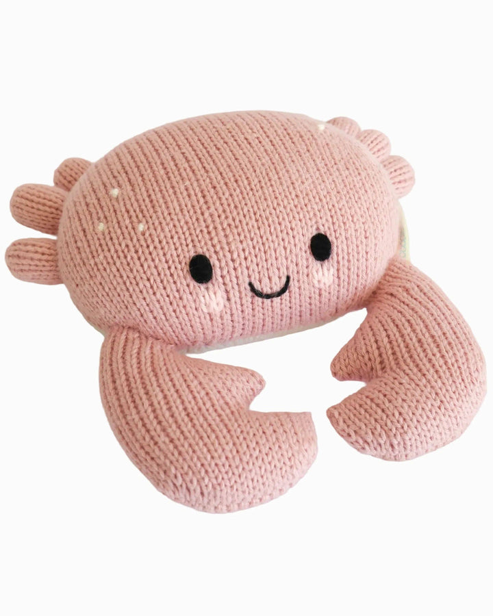 Cuddle + Kind Baby Crab in Blush, a limited edition hand-knit crab stuffed animal for babies