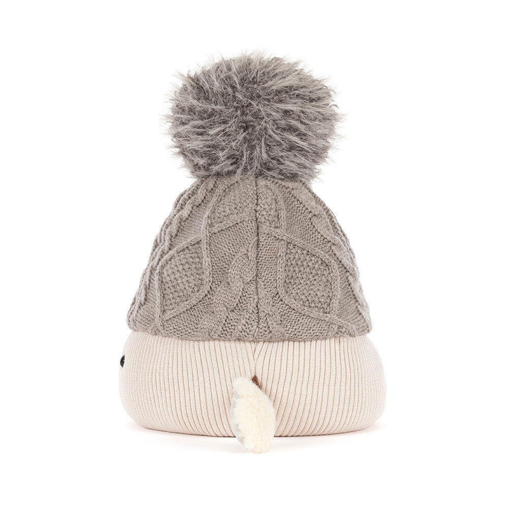 Side profile of Jellycat Amuseables Pomilly, a soft Christmas party hat plush stocking stuffer